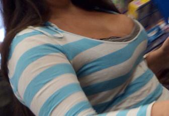 creep shot of a low cut top with big cleavage