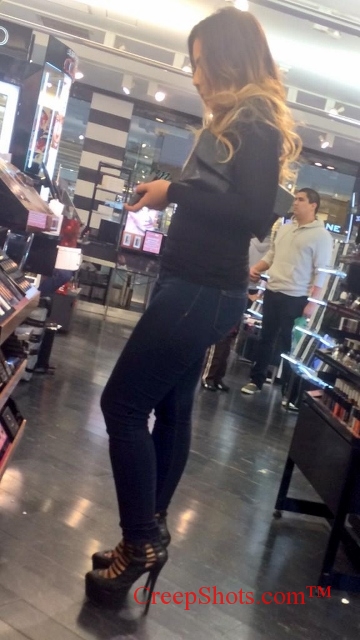 blonde in tight jeans and sexy heels shopping