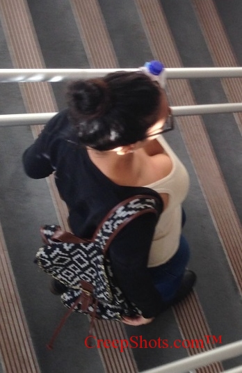 creep shot of brunette cleavage