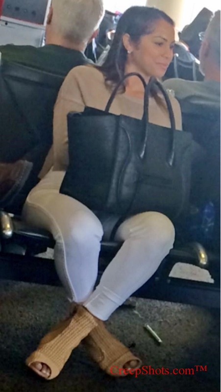 candid cutie sitting at the airport