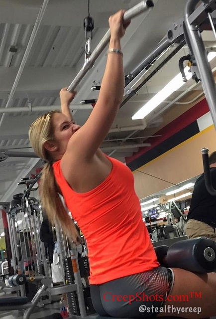 blonde girl working out at the gym
