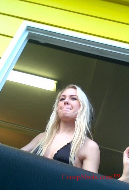 cute blonde barista serving coffee