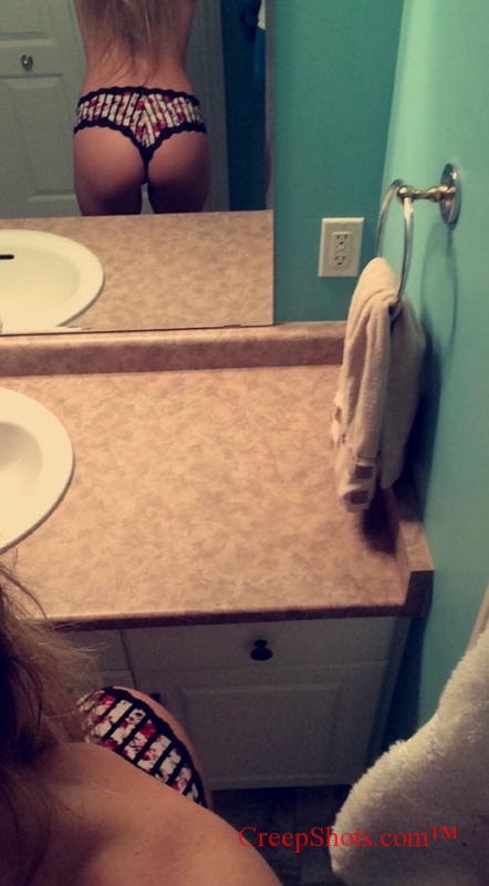 mirror selfie of a great ass in a thong