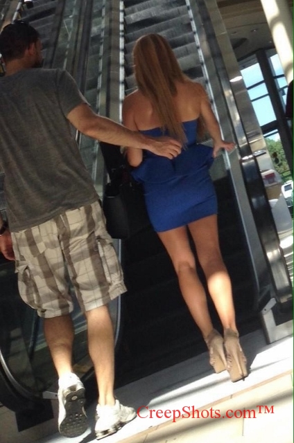 sexy legs and heels headed up an escalator