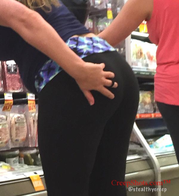 girl in leggings grabs her own phat ass