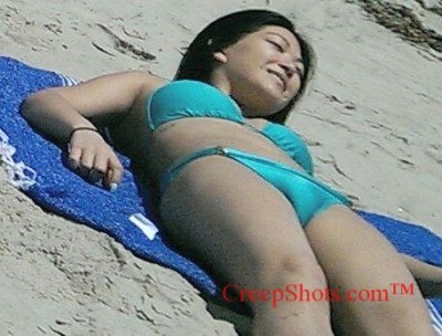 sexy asian getting a tan