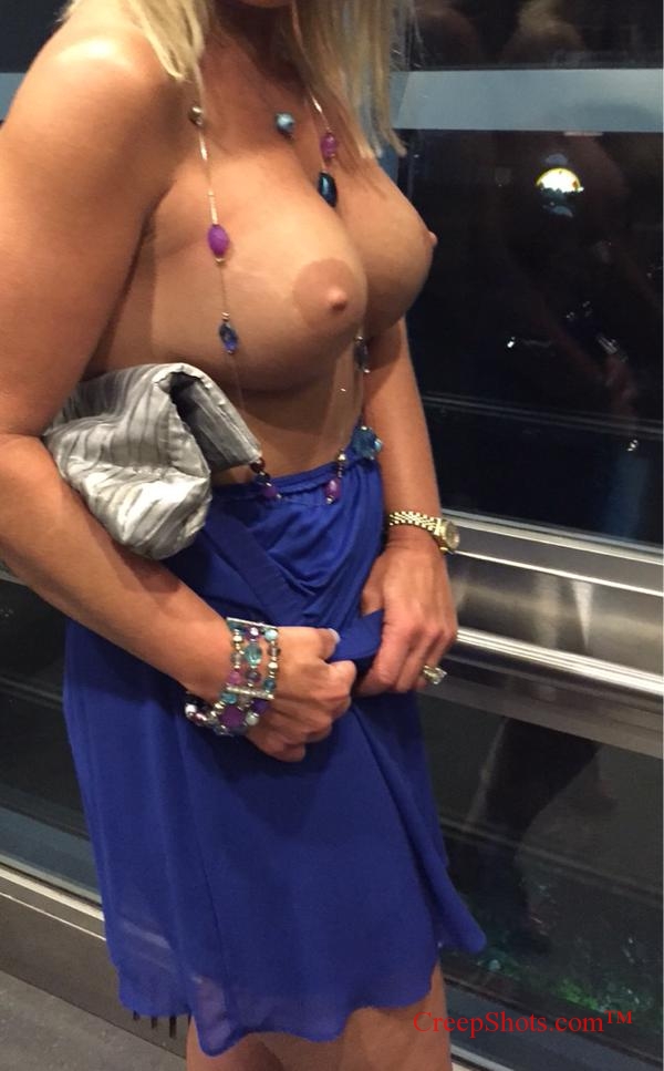 hot blonde flashing her boobs in public